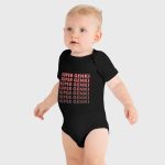 Super Genki Baby Short Sleeve One Piece [Faded Style] – standing baby wearing black bodysuit